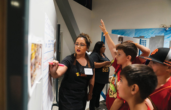 An educator introducing students to an software engineering activity.